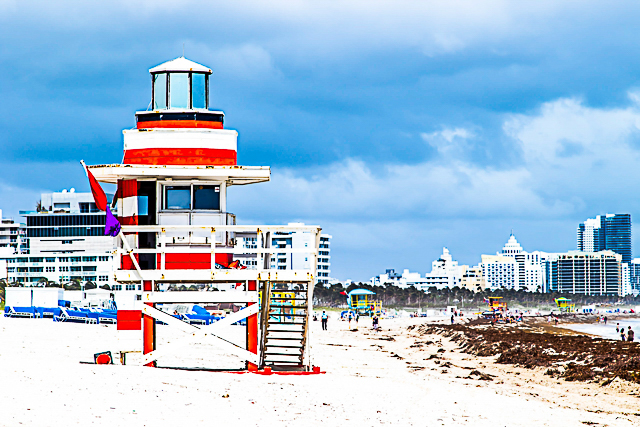 Art Deco lifeguard tower on South Beach with the Miami skyline behind