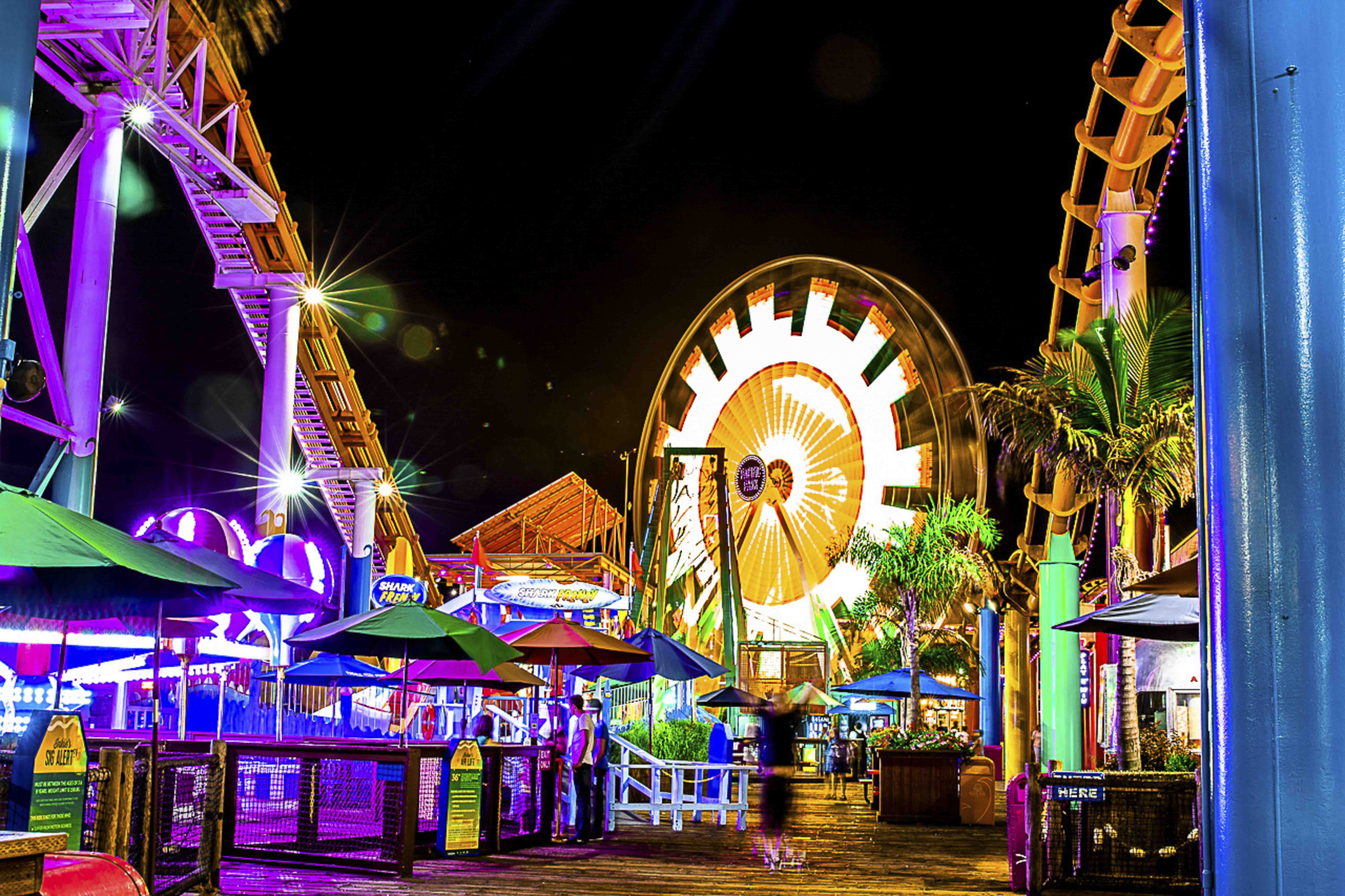 Santa Monica Pier boardwalk at night, the Ferris wheel in full color