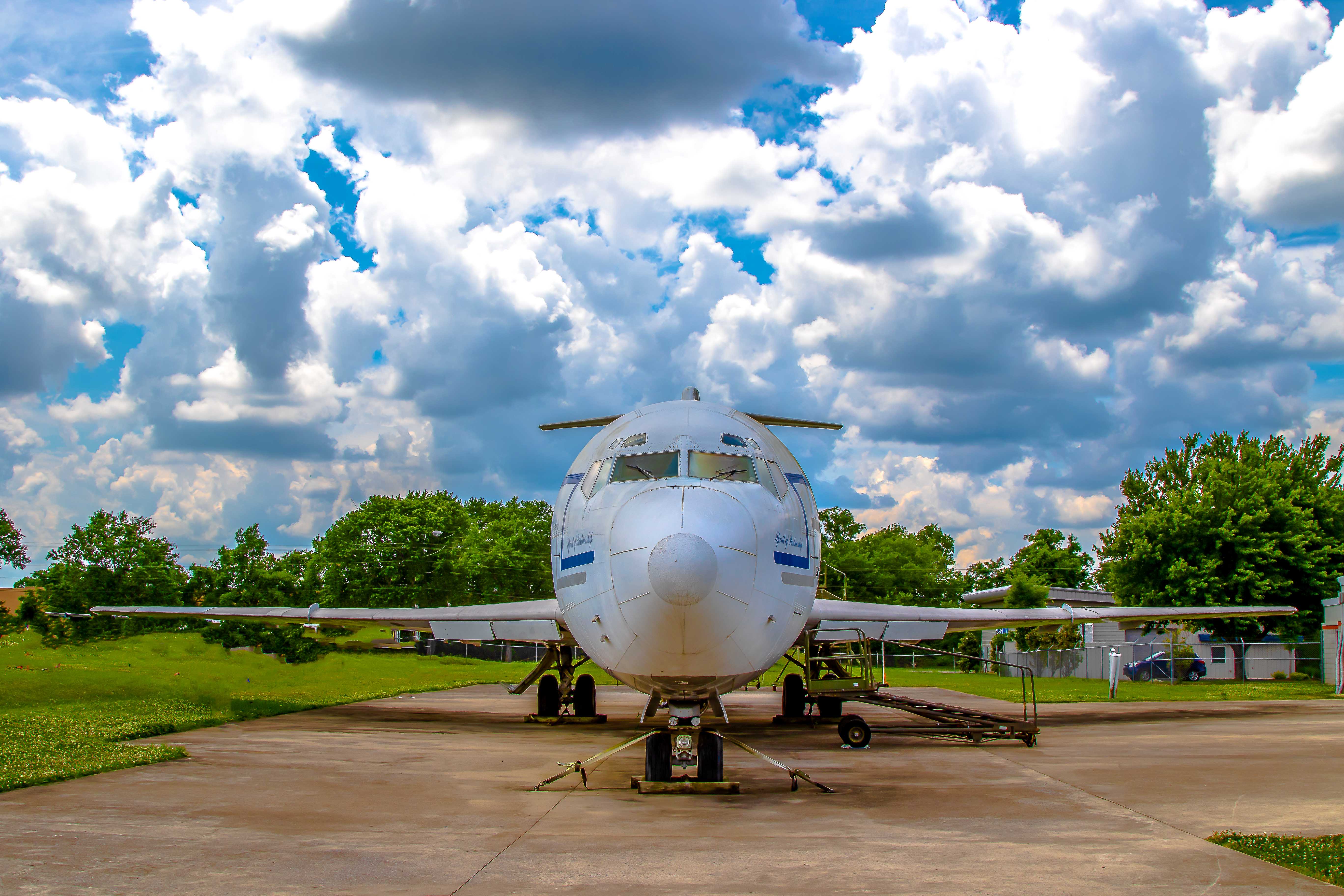 Airliner parked at the airport — head-on view with landing gear down