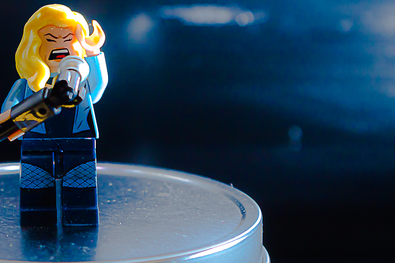 LEGO minifigure portrait — the classic yellow smile under studio lights