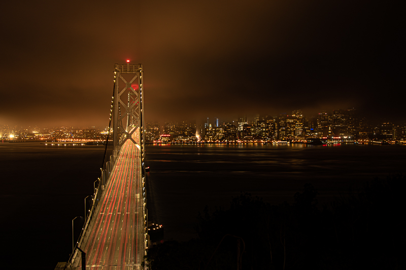 Bay Bridge panorama at night — from Yerba Buena Island to the San Francisco waterfront
