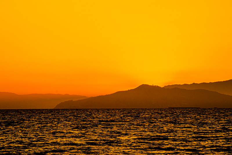 San Francisco skyline from Emeryville — city lights emerging at dusk