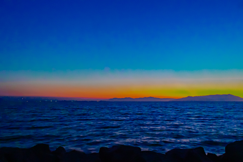 Wide shot of Emeryville Marina — bay, boats, and the San Francisco skyline