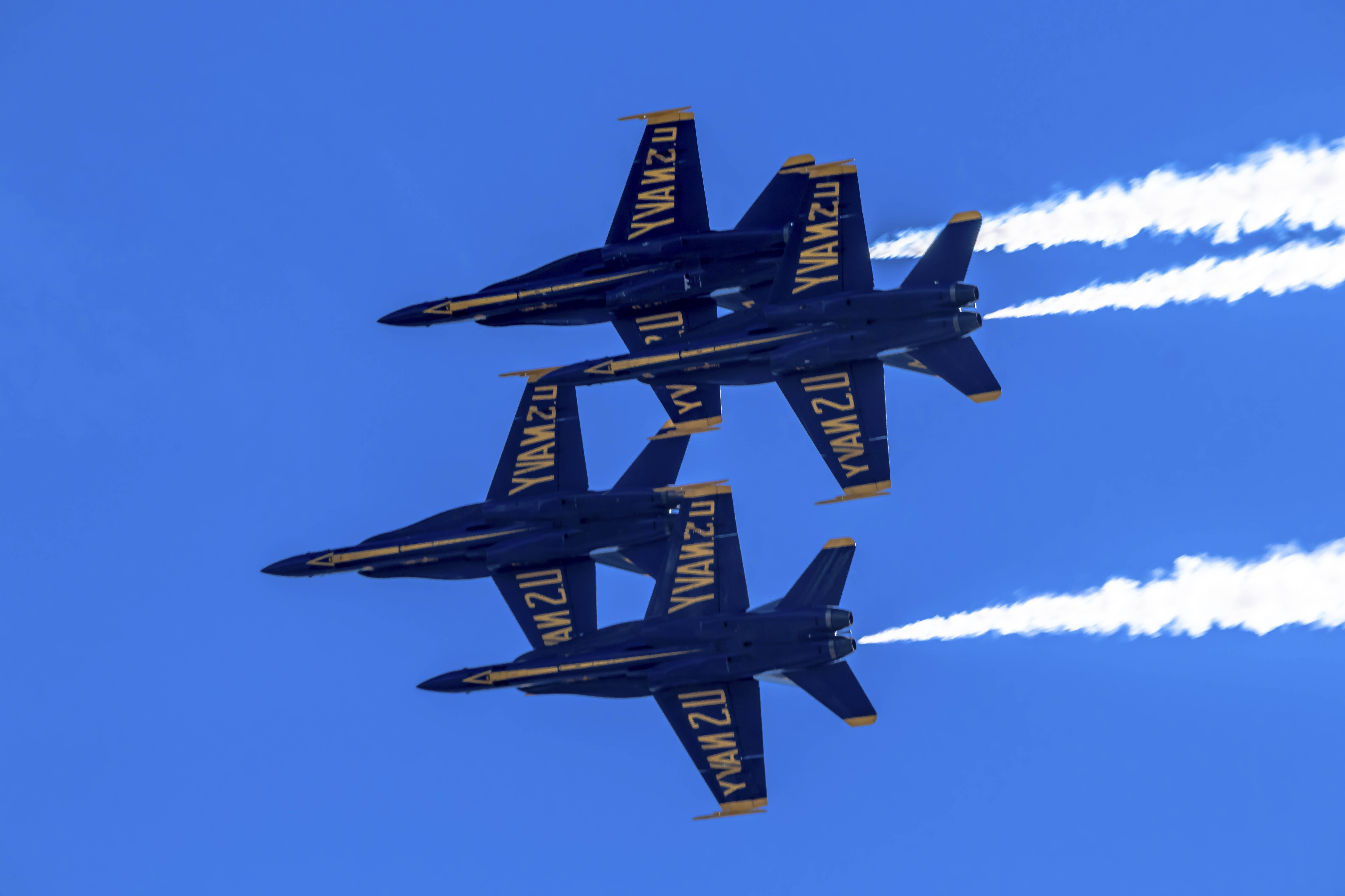 Blue Angels F/A-18 in tight formation banking over San Francisco