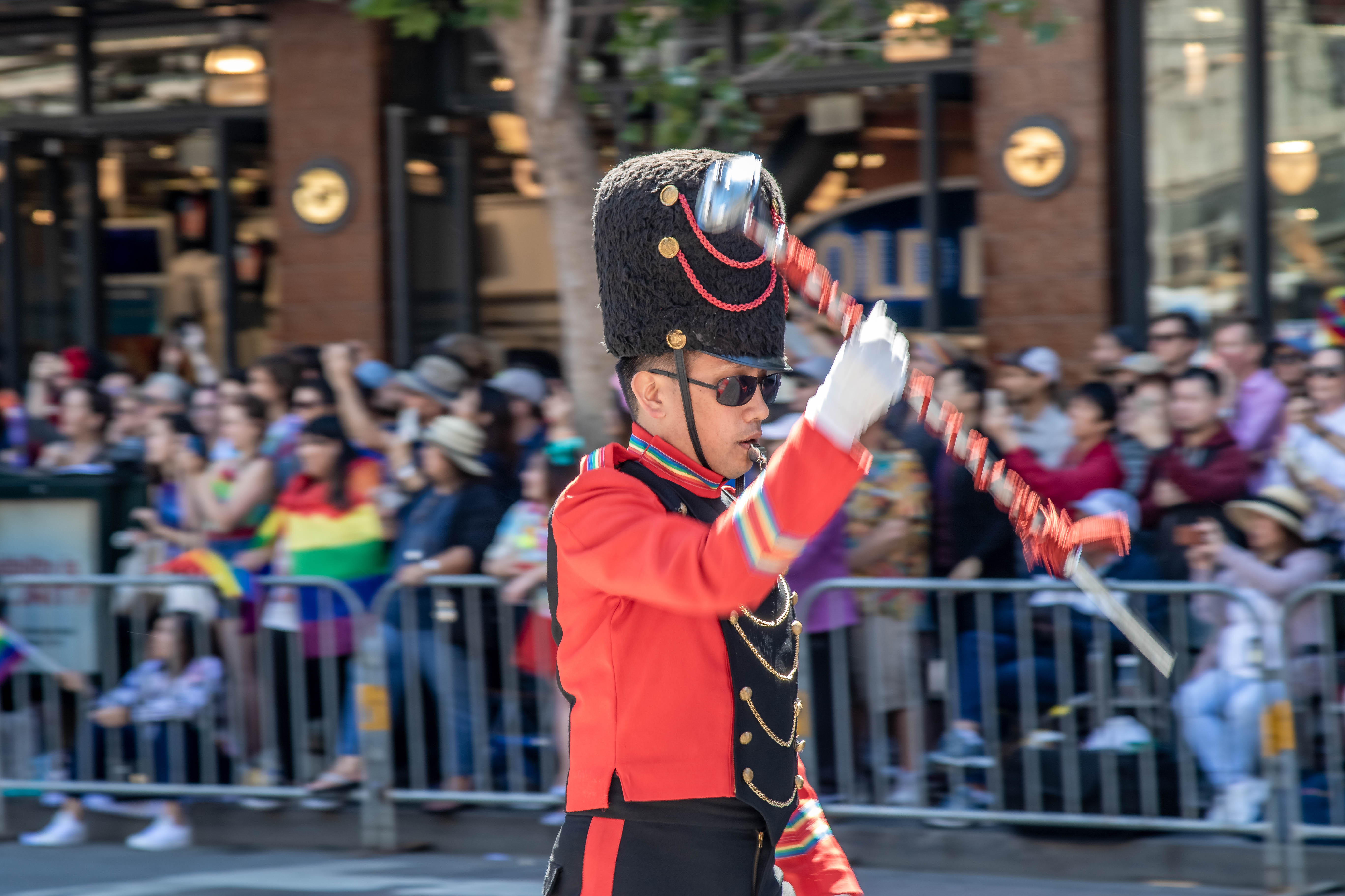 Freedom Band saxophonist in close-up — red uniform and marching cap