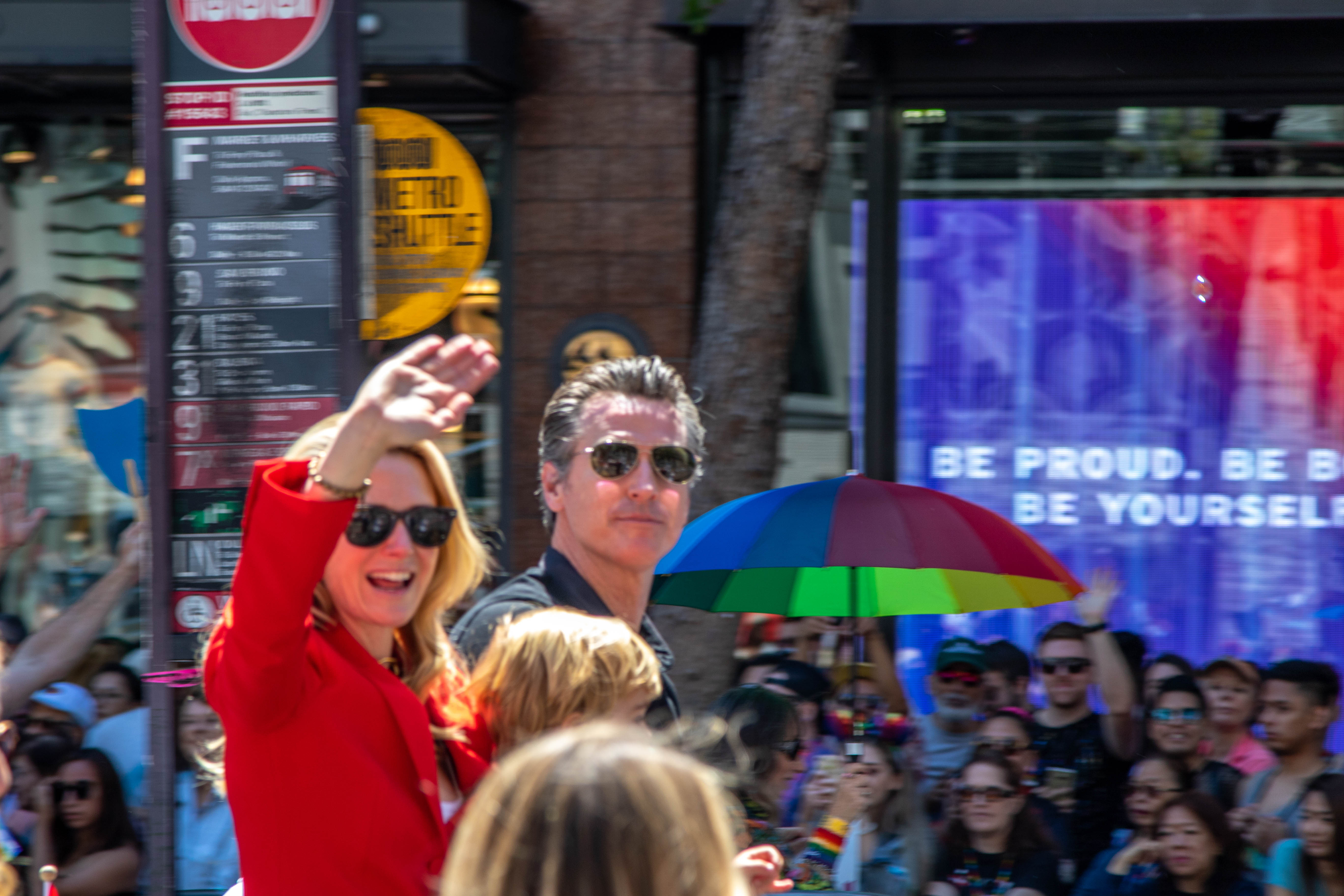 SF Pride — musician with pride badge and rainbow plume