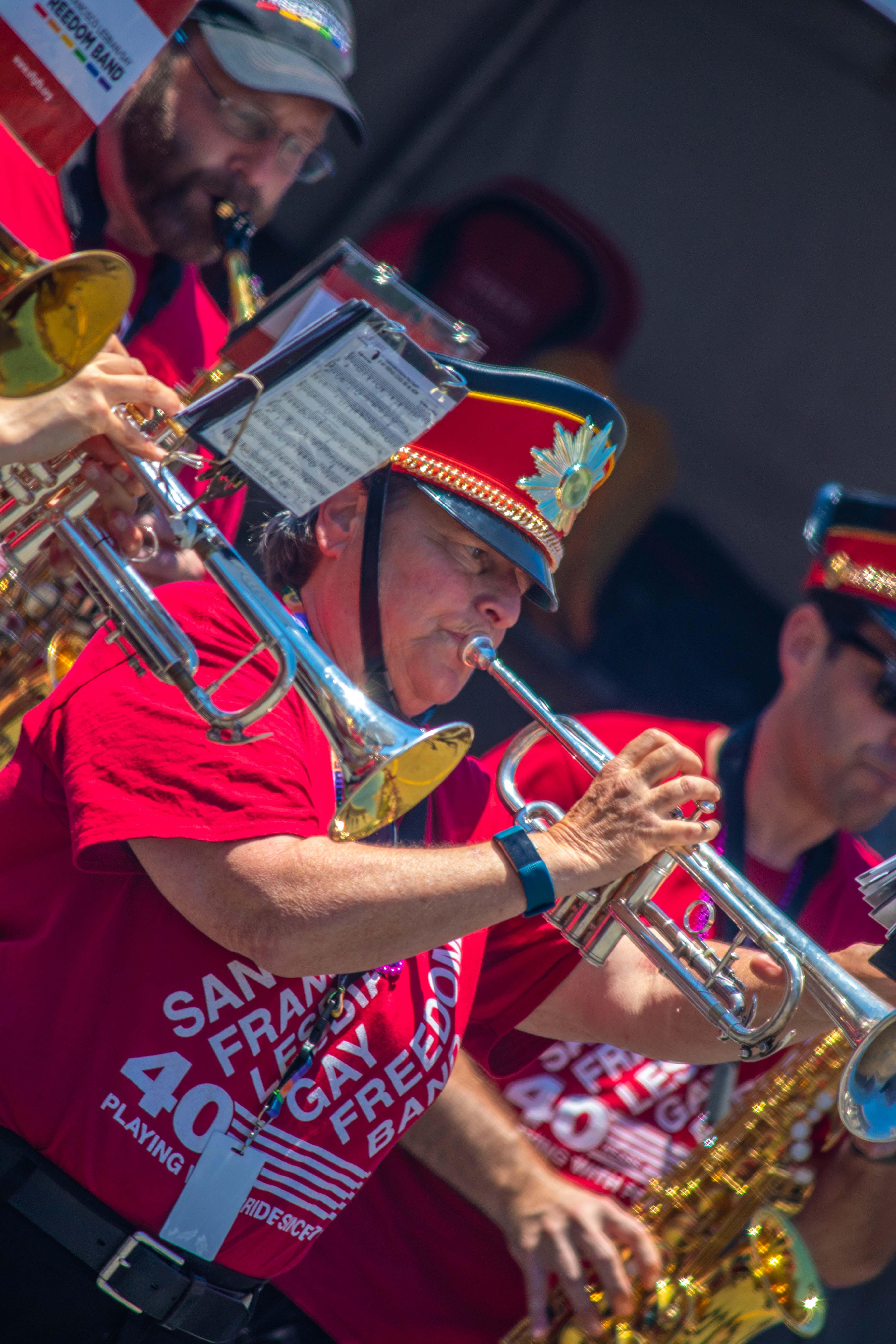 SF Pride Parade — band member playing mellophone in the sun
