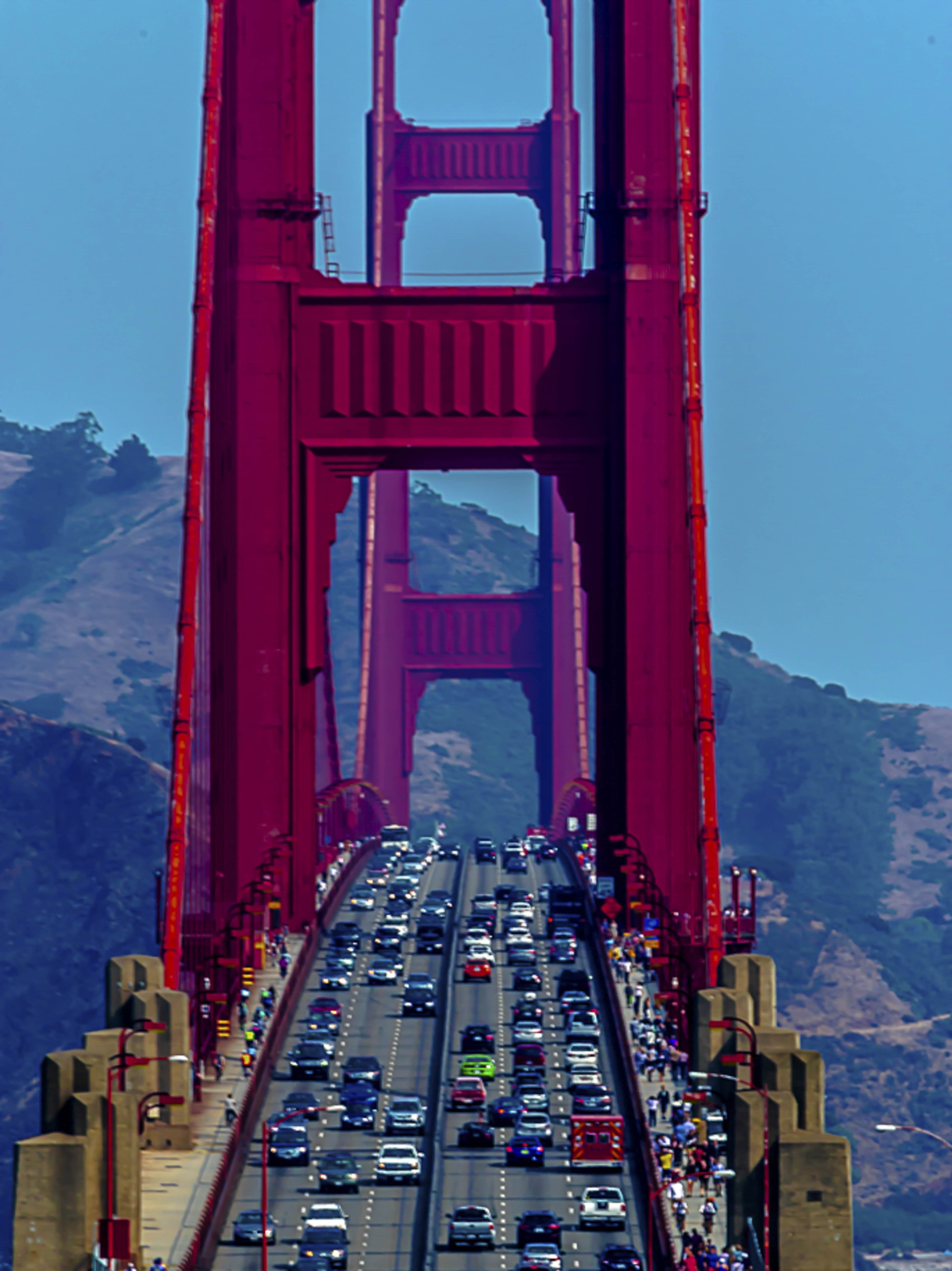Traffic flowing through the Golden Gate Bridge, shot from the bridge deck