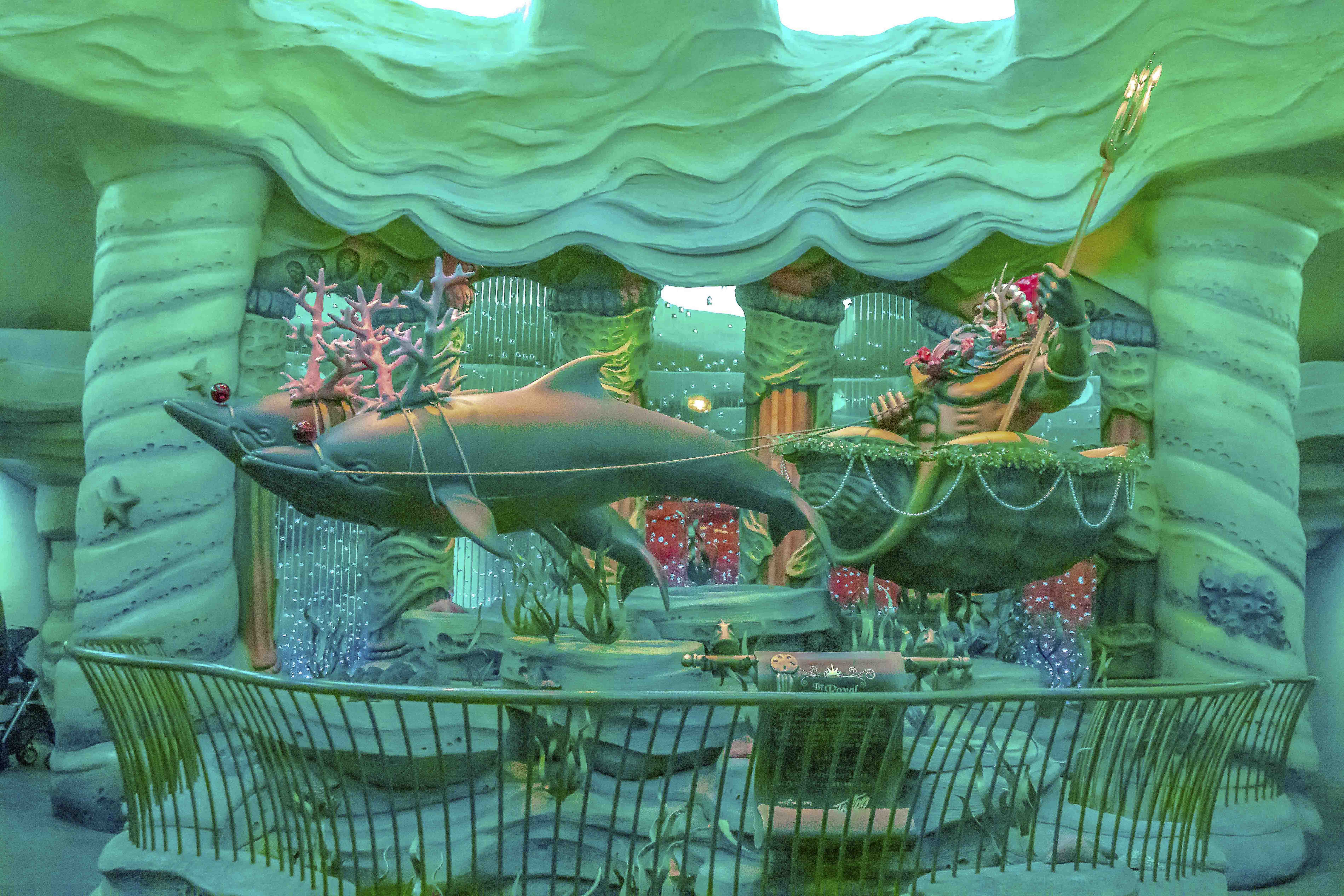 Mermaid Lagoon — King Triton's holiday display with a leaping dolphin and sea decorations