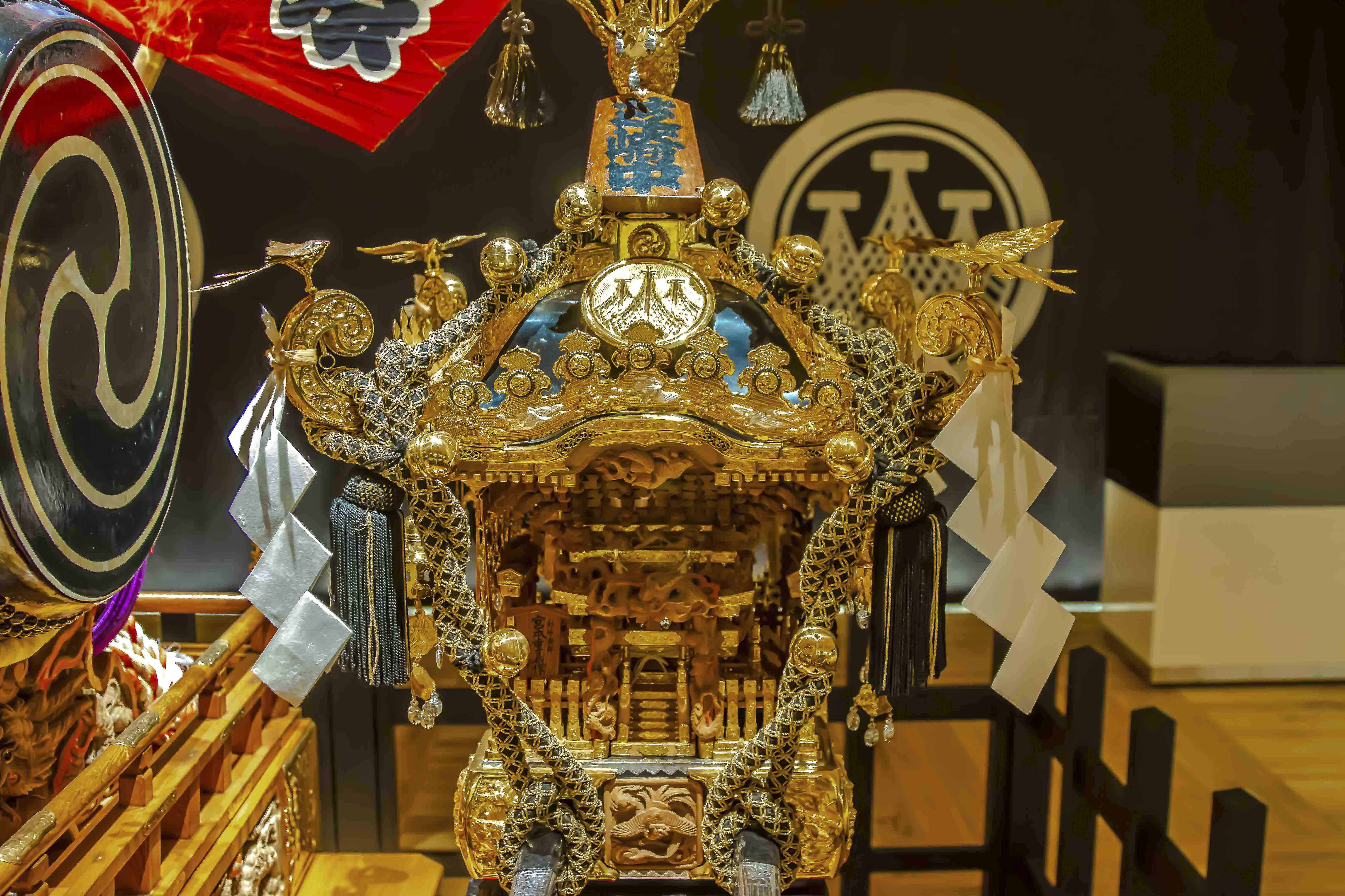 Golden mikoshi portable shrine on display