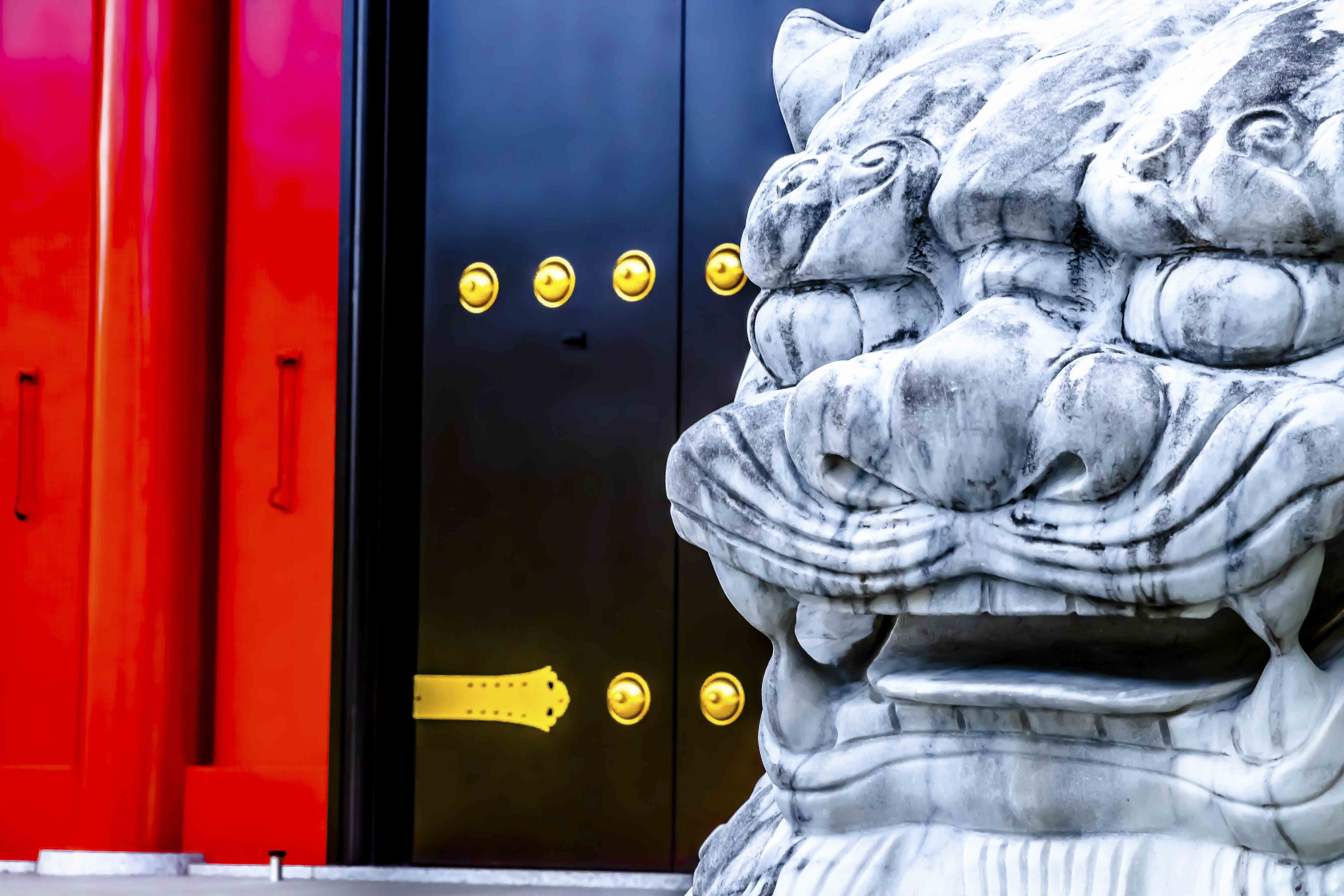 Stone guardian lion-dog at Senso-ji Temple gate