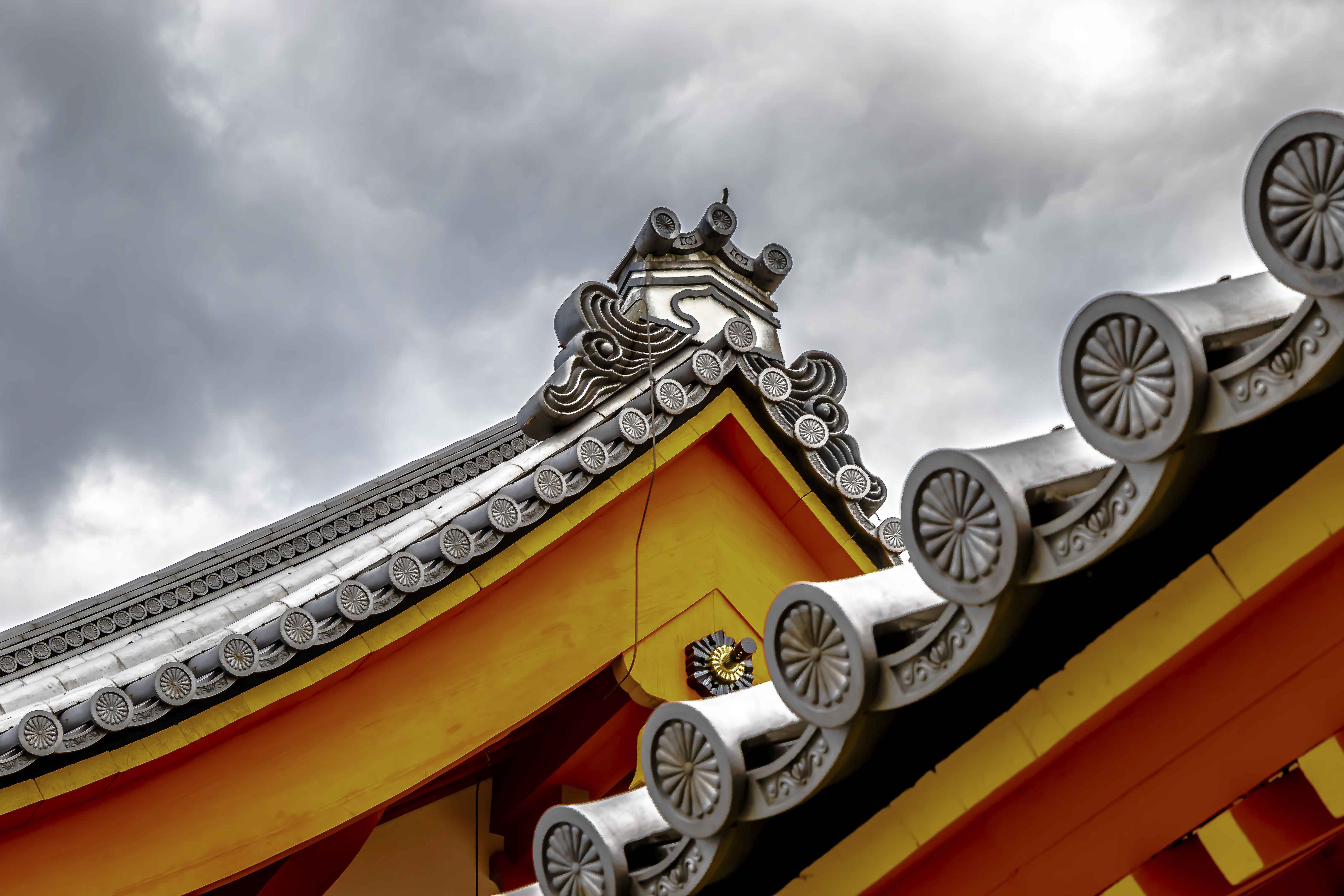 Ornate roofline with chrysanthemum tile decorations