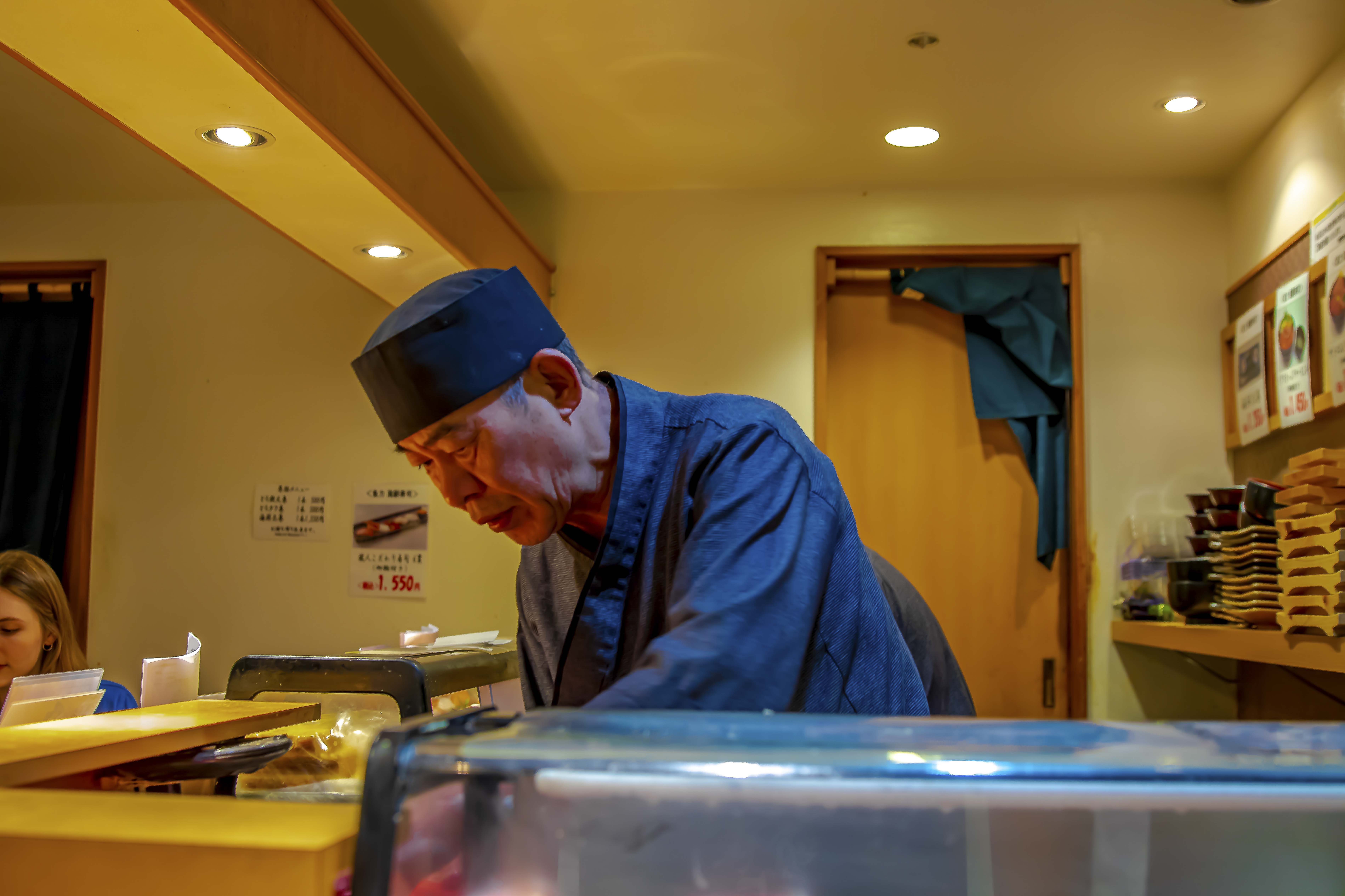 Sushi master at the bar